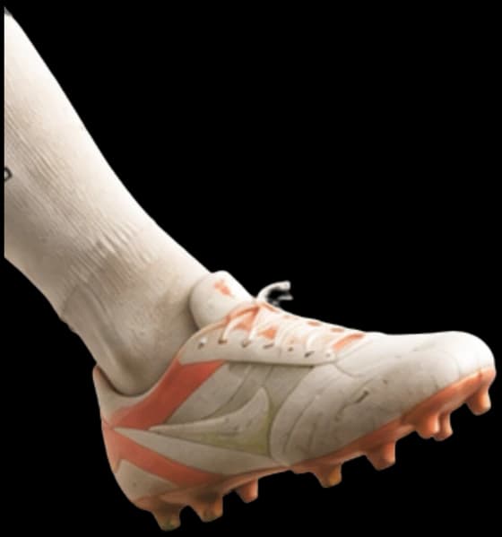 Leg kicking a football